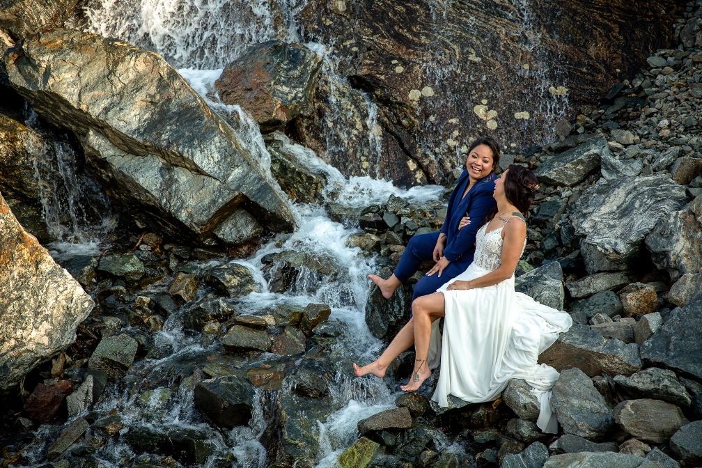 eloping couple at a waterfall