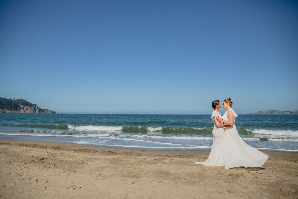 two brides on the beach in California - how to plan an elopement