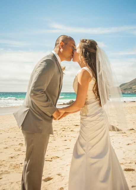 california beach wedding kiss