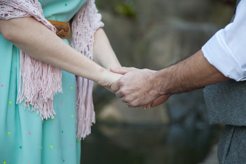 holding hands during the ceremony