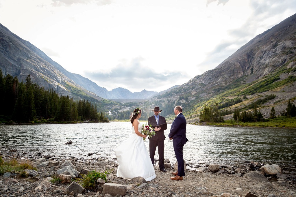Couple eloping at an alpine lake in the Rocky Mountains
