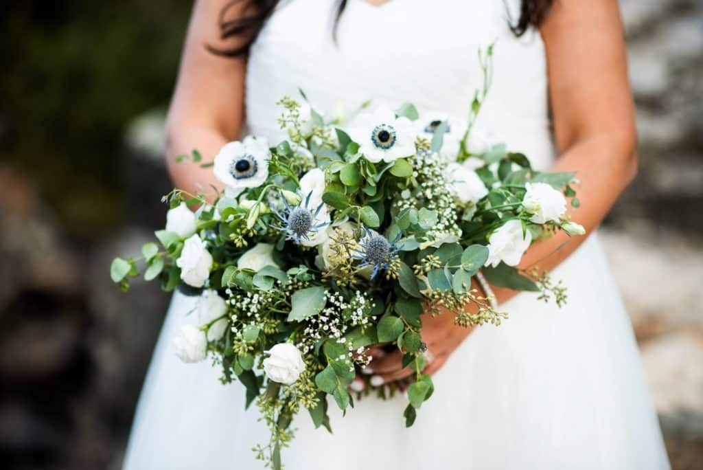 bridal bouquet in white, dusty blue and greens