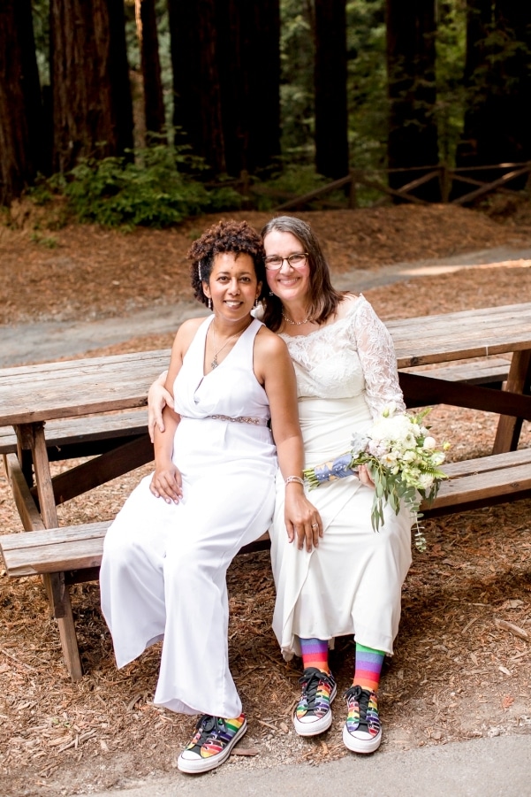 Hally and Majia on a picnic bench in the redwoods