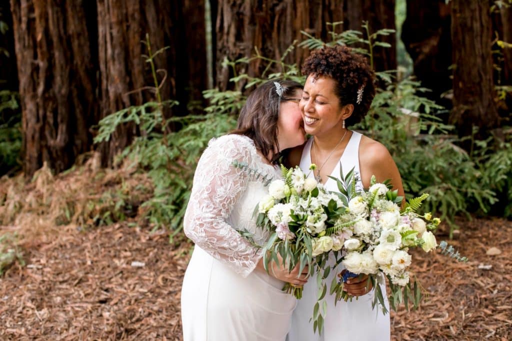 two brides with matching bouquets