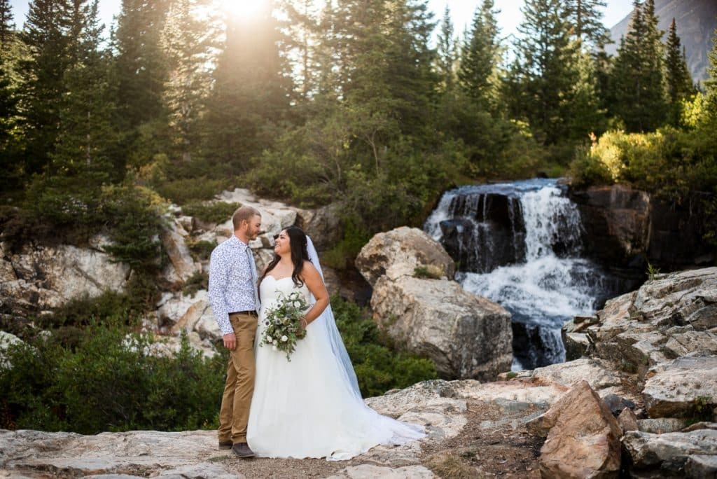 after the wedding in front of the waterfall