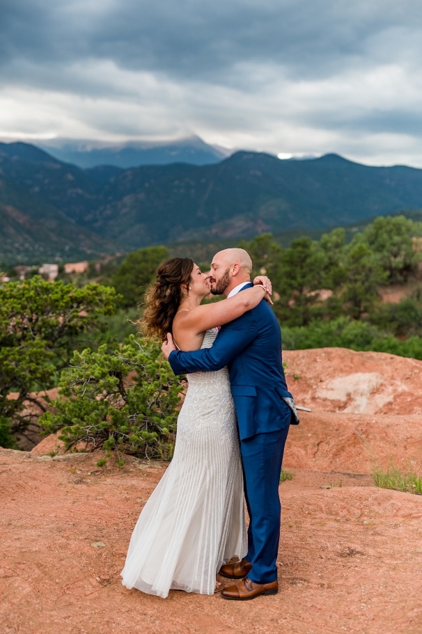 first kiss after being married at Garden of the Gods