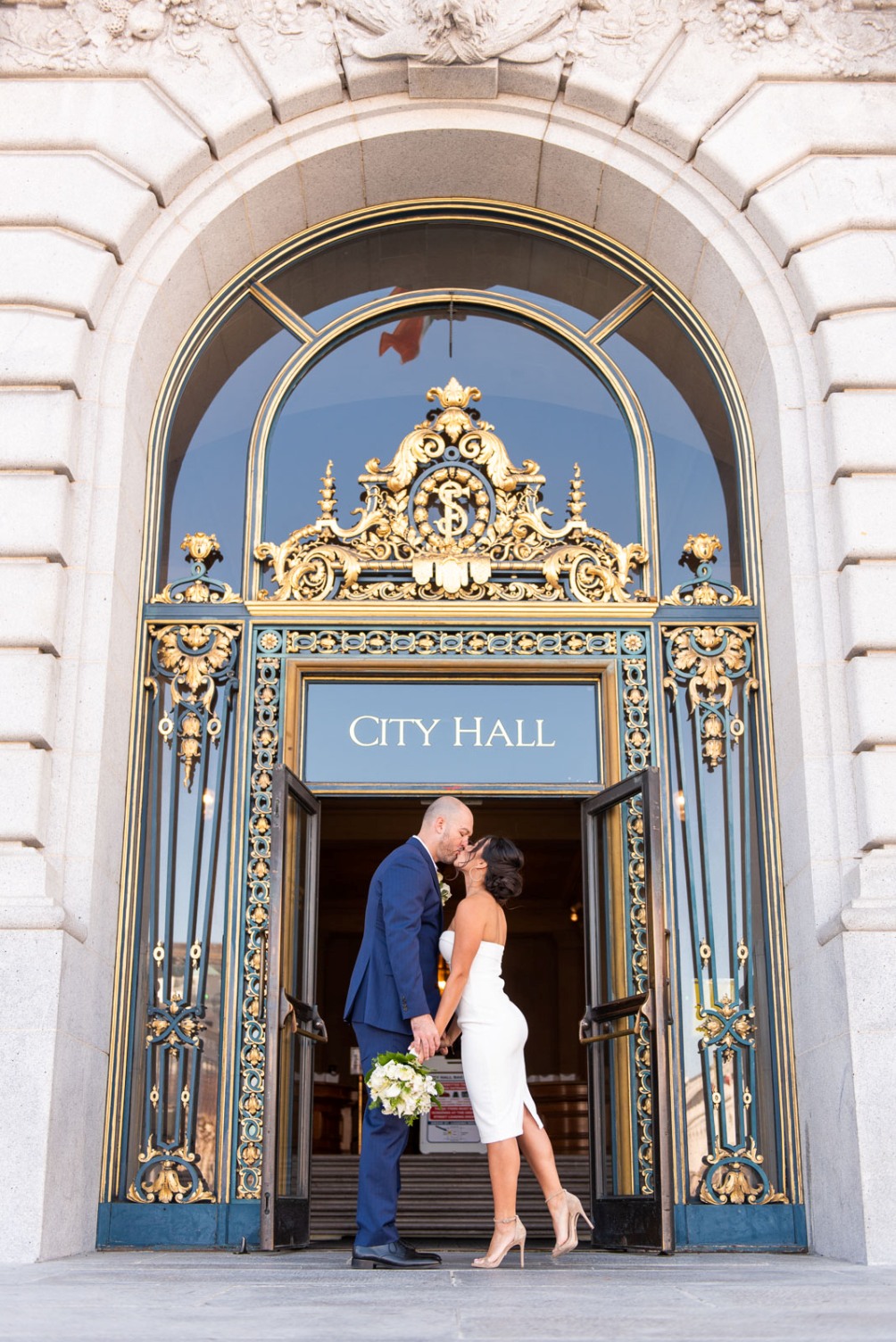 Couple kissing outside San Francisco City Hall