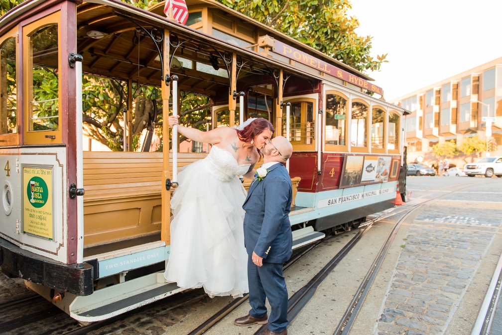 couple eloping on a San Francisco cable car