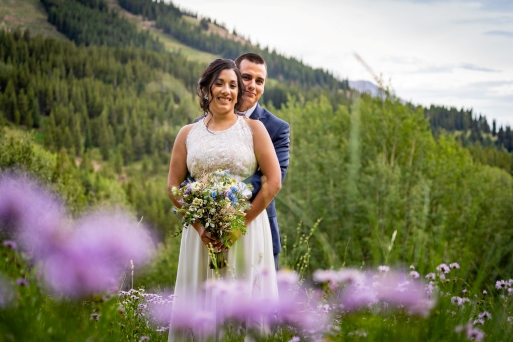 Alex and Mary in the wildflowers on their wedding day