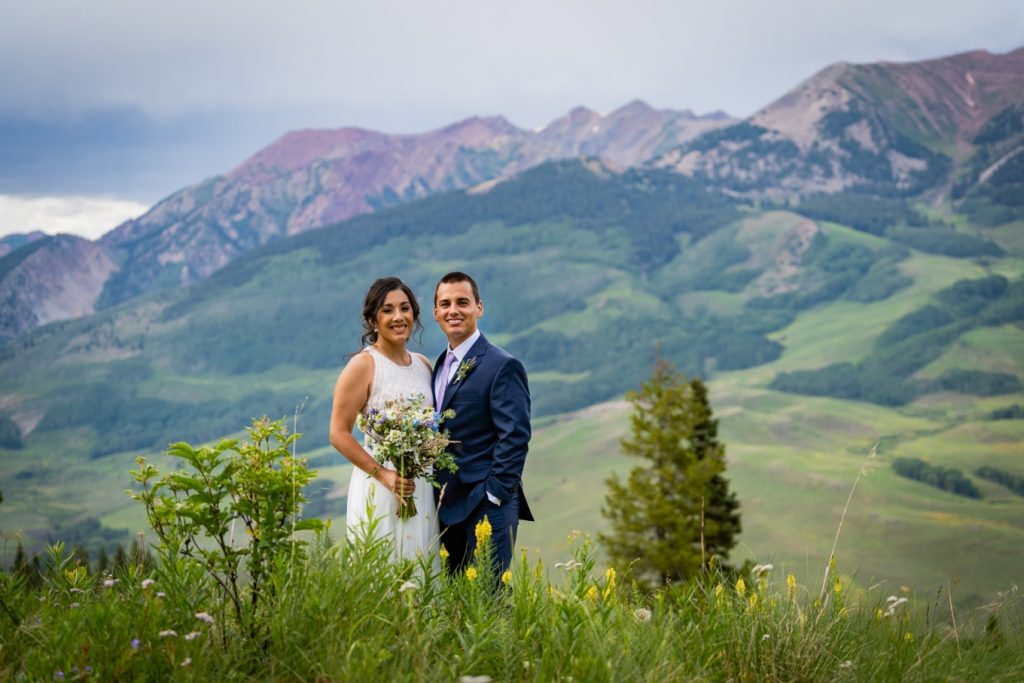 Couple standing in front of Mount Crested Butte