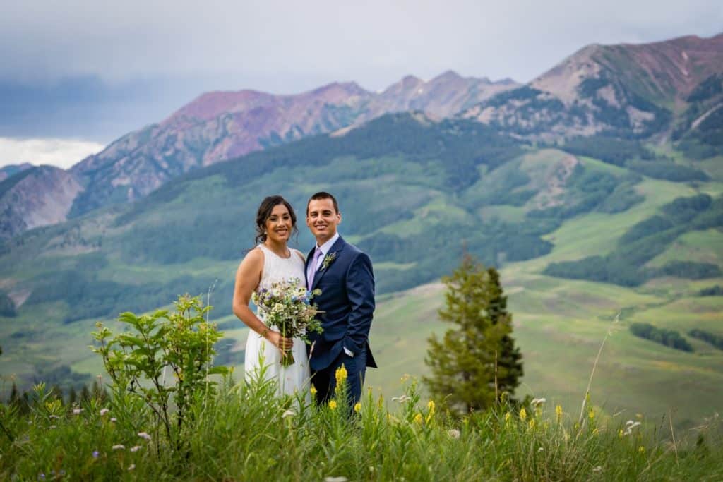 Couple standing in front of Mount Crested Butte