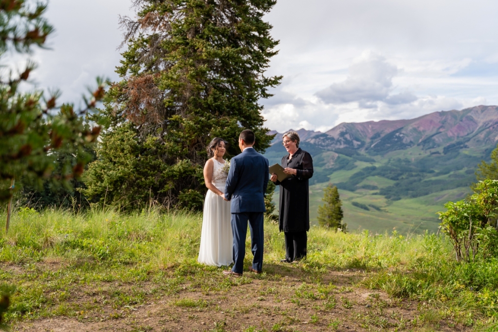 elopement wedding cermeony--officiant and couple--in Crested Butte