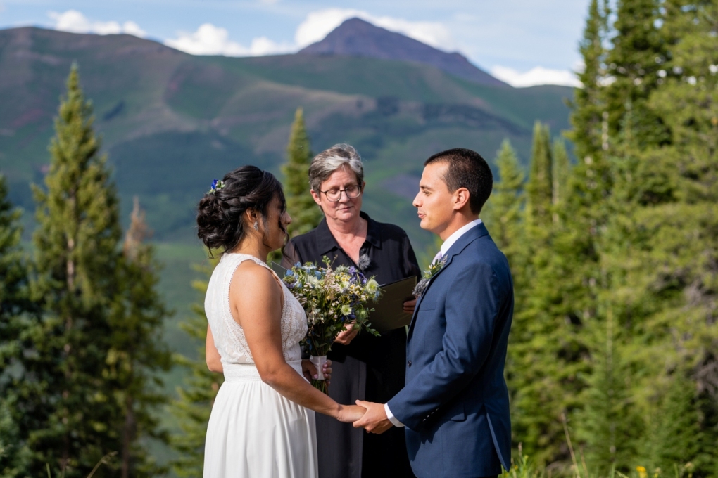 couple exhanching vows in an elopement ceremony