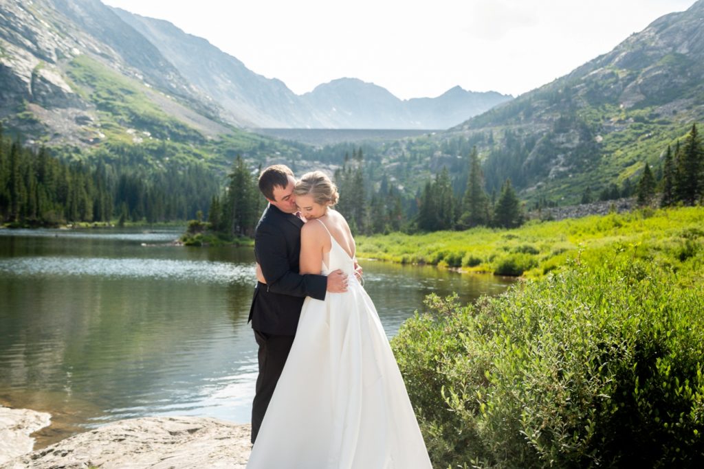 couple kissing at their mountain elopement