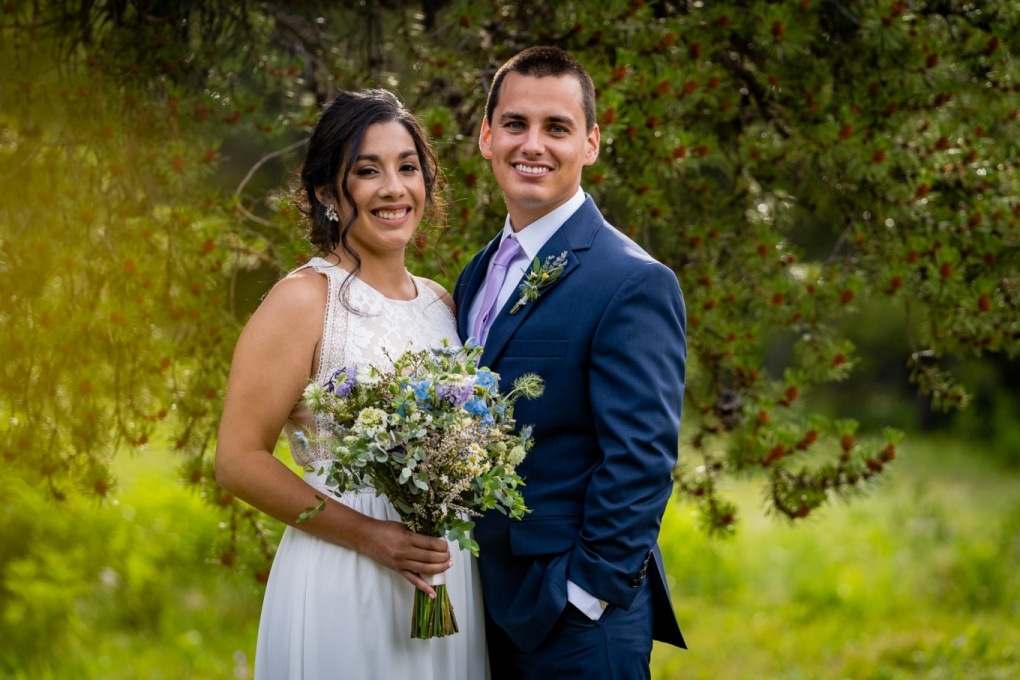 couple standing in a meadow