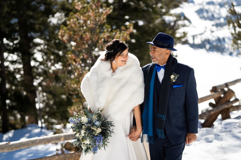 bride and groom hand in hand - winter elopement