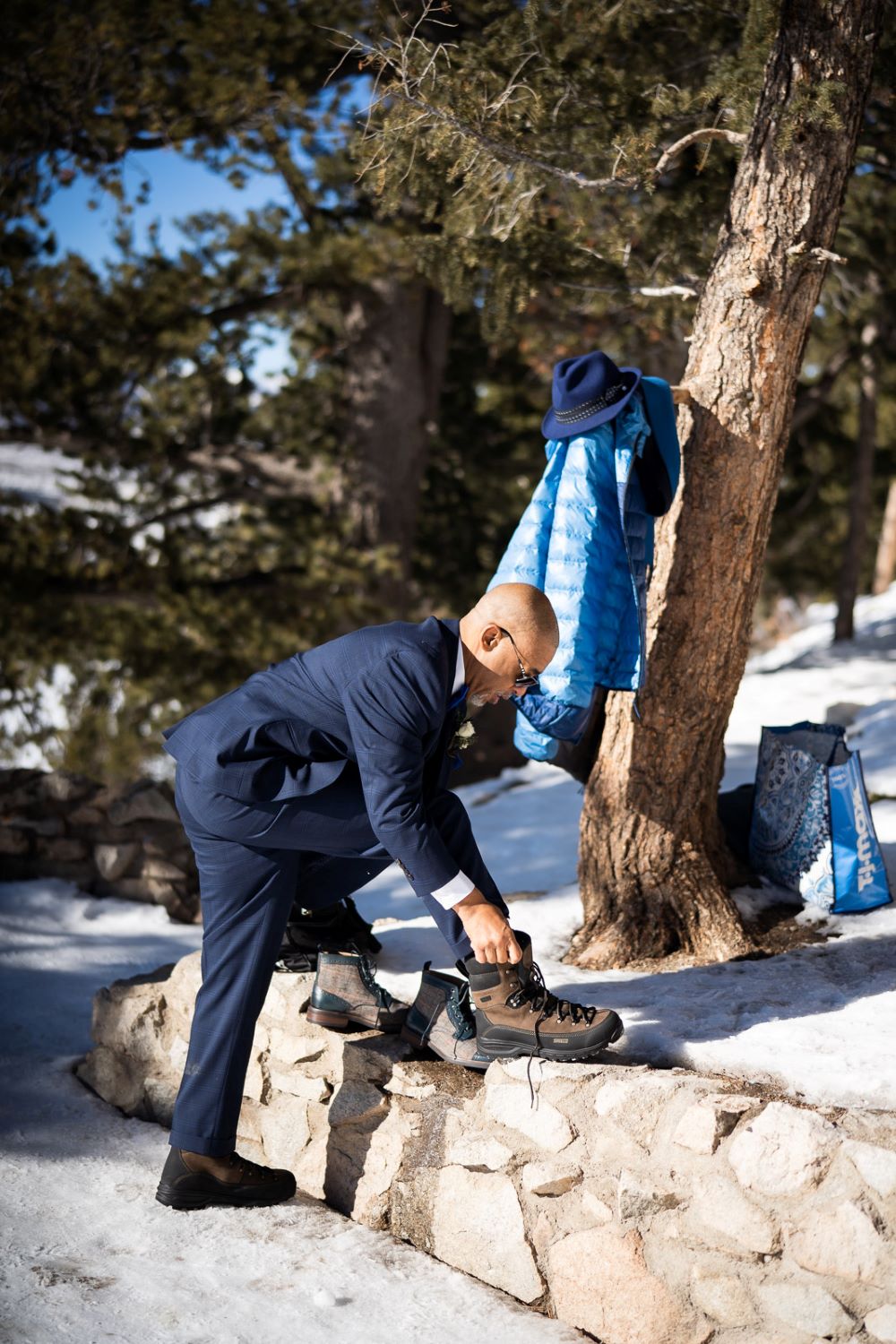 Groom lacing up winter boots