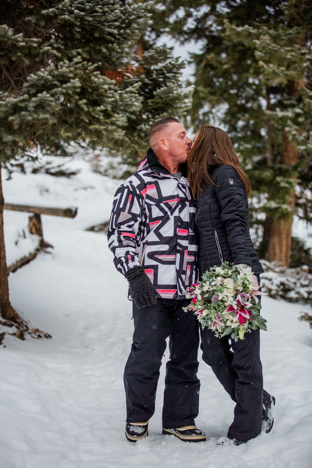 couple wearing ski wear for their winter Colorado elopement