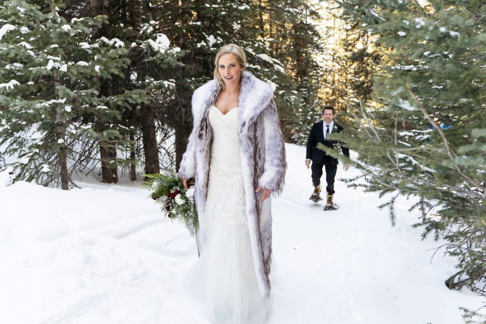 bride in a fir coat - Elope in Colorado in winter