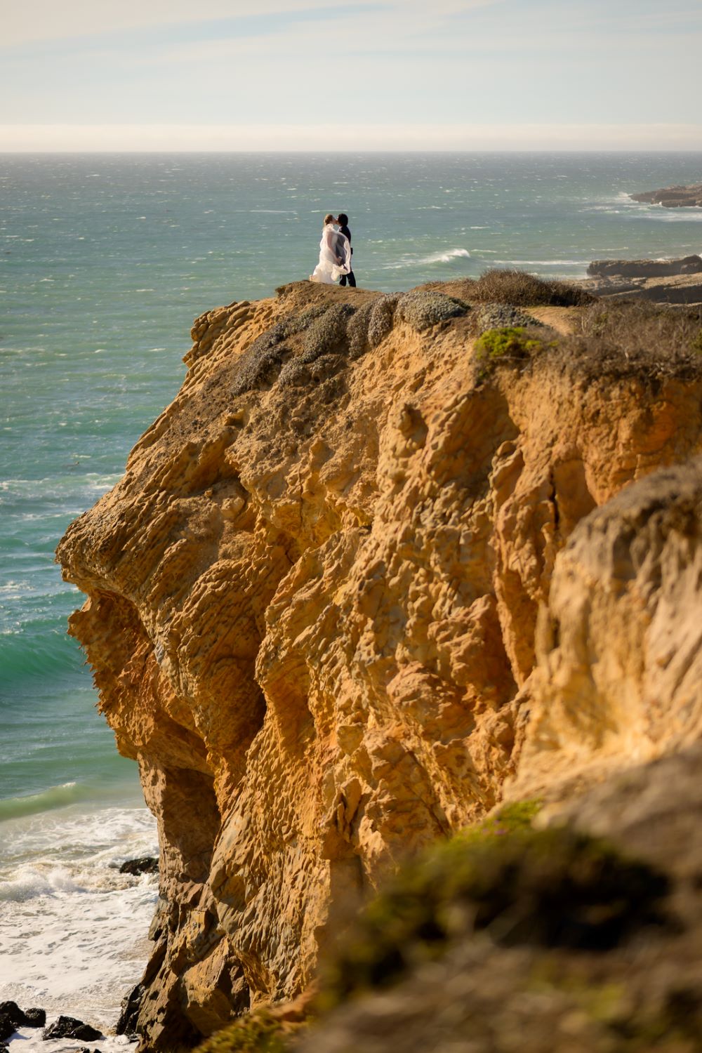 Couple kissing on the rocks - Santa Cruz beach elopement