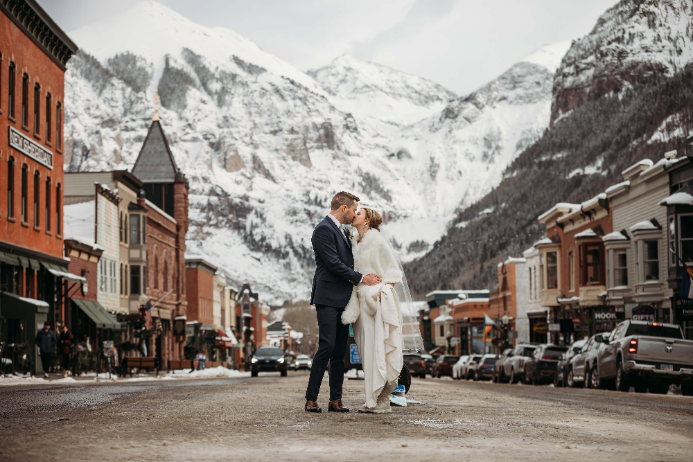 Couple kissing, downtown Telluride - Colorado winter elopement
