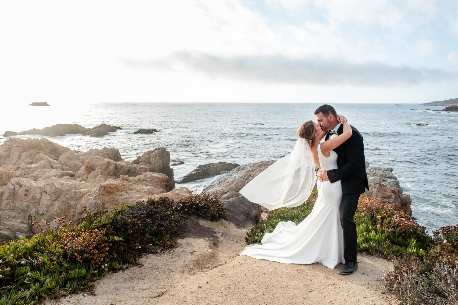Couple kissing after their elopement on the California coast